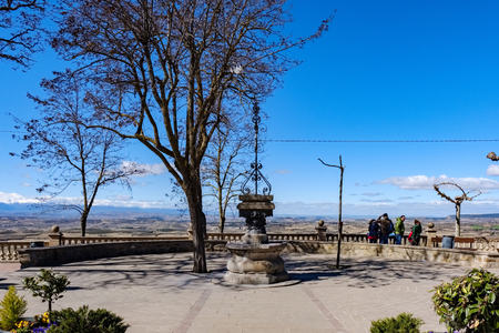 Laguardia, Alava, Spain. March 30, 2018: Plaza de Las Cruces with a viewpoint with magnificent view of the flat landscape of La Rioja and mountains with snow from the sierra called the demand to the bottomのeditorial素材