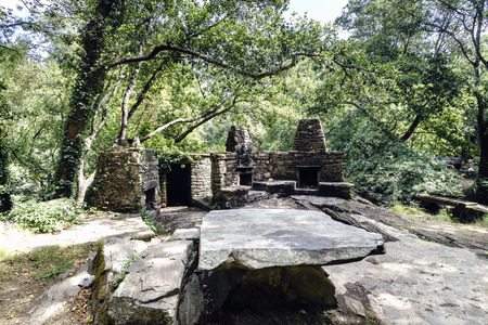 Snack area with stone barbecues and tables and benches for picnics in a glade of a typical Atlantic forest in Galicia, Spainの写真素材
