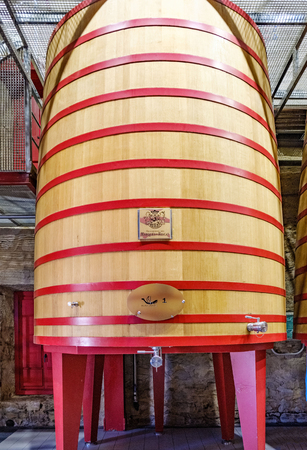 Elciego, Álava, Spain. April 23, 2018: Large wooden tub where the grapes are thrown so that they begin to ferment in the wine cellars of La Rioja called "Marqués de Riscal"のeditorial素材