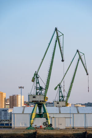 Two heavy cranes for loading merchant ships in the port of La Coruna in Spain