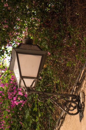 Old streetlamp on a wall in Mallorca, Spainの写真素材