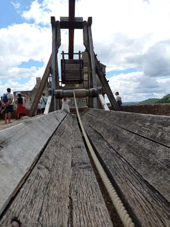 Castelnaud-la-chapelle, Dordogne, France - Jully 3 2020: Medieval trebuchet catapult Castelnaud Castle in Dordogne valley, Perigord Noir, Franceのeditorial素材