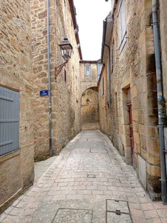 Sarlat la Caneda, France - July 2, 2020: Picturesque street in the medieval old town of Sarlat la Caneda, PÃ©rigord, Dordogne, Franceのeditorial素材