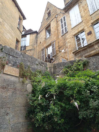 Sarlat la Caneda, France - July 2, 2020: Picturesque street in the medieval old town of Sarlat la Caneda, PÃ©rigord, Dordogne, Franceのeditorial素材