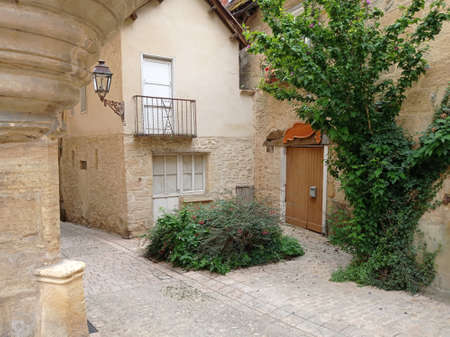Sarlat la Caneda, France - July 2, 2020: Picturesque street in the medieval old town of Sarlat la Caneda, PÃ©rigord, Dordogne, Franceのeditorial素材