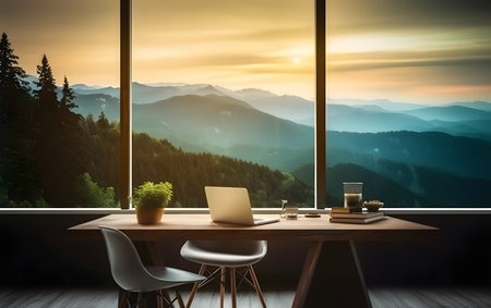Workplace with computer on wooden table and panoramic window with mountain view at sunset. 3D Renderingの素材