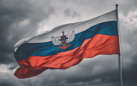 National flag of the Republic of Serbia waving in the wind against dark stormy skyの素材