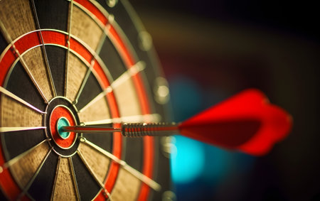 Darts arrows hitting the center of dartboard, business success conceptの素材