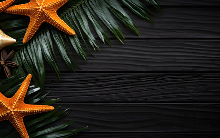 Summer background with starfish and palm leaves on black wooden background.の素材