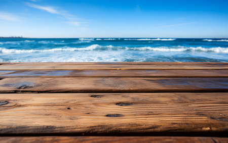 Wooden deck on the beach with sea and blue sky background.の素材
