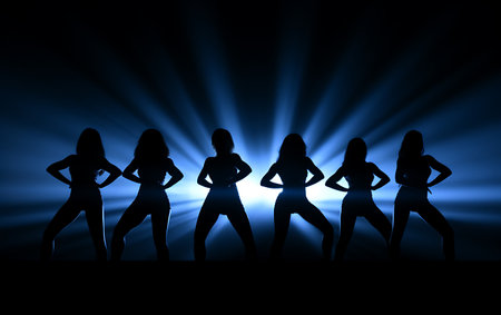 Silhouette of a group of women dancing on a dark backgroundの素材