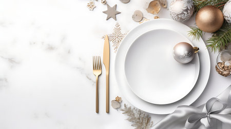 Christmas table setting with golden cutlery and christmas decorations on the backgroundの素材