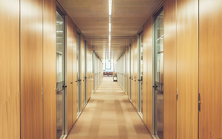 Perspective view of empty corridor in modern office building. 3d renderingの素材