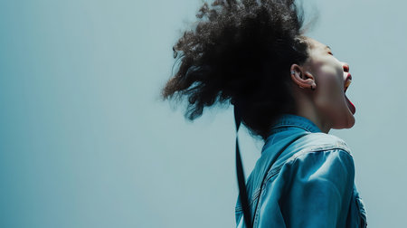 young beautiful hipster woman in the city street with backpack happy and excitedの素材