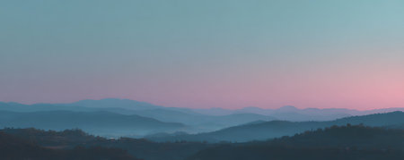 Panoramic view of the mountains in the fog at sunset.の素材