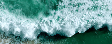 Aerial view of ocean waves. Top view of ocean waves breaking on shore.の素材