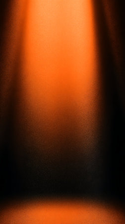 abstract orange background with some smooth lines in it and a spotlightの素材