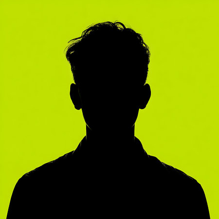 Silhouette of a man's head on a green background.の素材