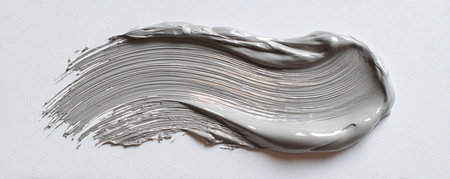 close up of a white paint brush on white textured backgroundの素材