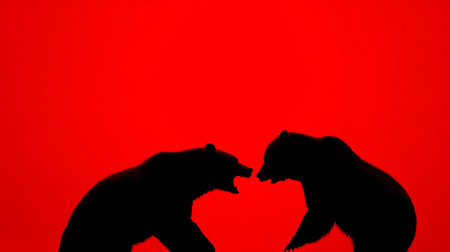 Silhouette of a bear and a bear on a red backgroundの素材