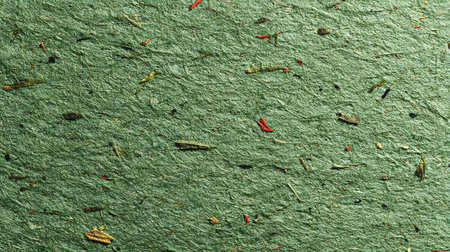 Green paper texture with red hot chili pepper. Background and texture for design.の素材