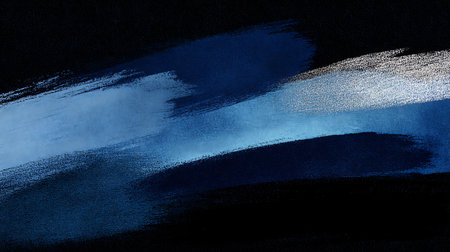 Abstract hand painted watercolor background. Blue and white strokes on black paper.の素材