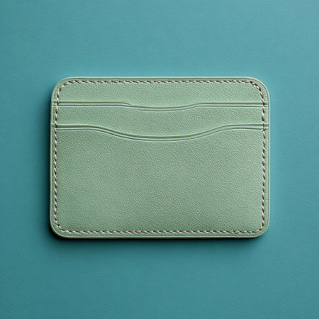 Green leather wallet isolated on blue background. 3d render illustration.の素材