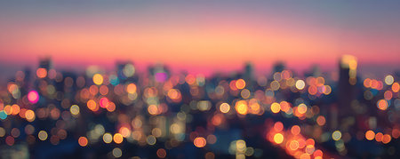 Blurred cityscape at sunset. Bokeh lights background.の素材