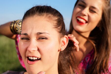 Girl gets the plait too tight
