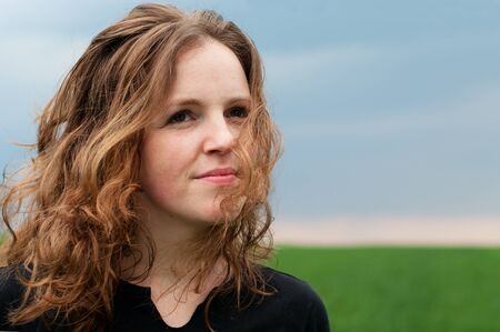 Woman looking at the stormy sky の写真素材