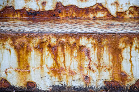 The texture of the old rusty metal. Streaks of rust on a white background. Use for design.