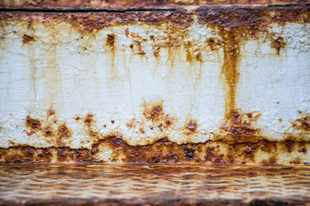 The texture of the old rusty metal. Streaks of rust on a white background close up.の写真素材