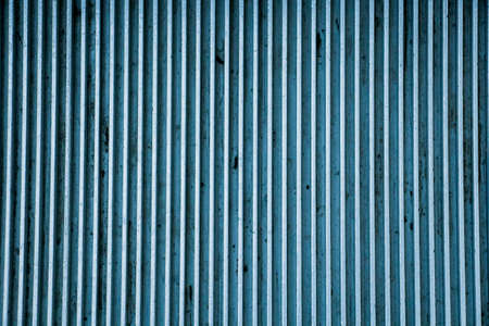 Striped blue metal plate texture close upの写真素材