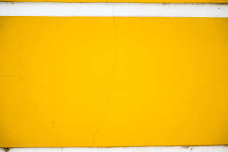 Wall with yellow stucco close-upの写真素材