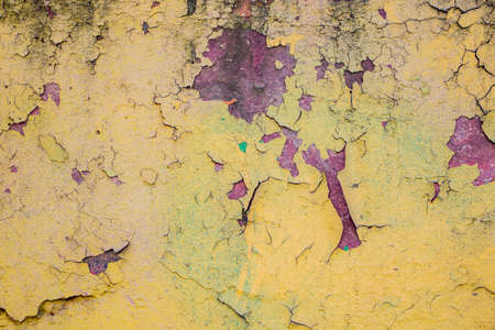 Old peeling paint on the wall closeupの写真素材