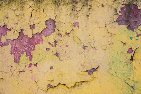 Old peeling paint on the wall closeupの写真素材