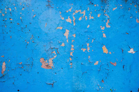 Old peeling paint on the wall closeupの写真素材