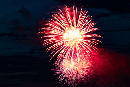 Beautiful multi-colored festive fireworks in the night skyの写真素材