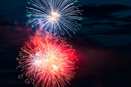 Beautiful multi-colored festive fireworks in the night skyの写真素材