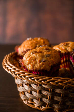 Appetizing homemade muffins on a wooden cutting board. Traditional festive Christmas baking.