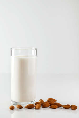 A glass of almond milk on whiteの写真素材