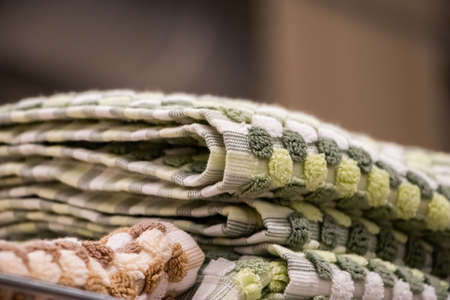 Sale of soft bath towels in the store. Stack of spa accessories.の写真素材