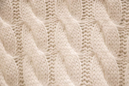 The texture of a knitted cozy sweater. Knitting, home accessories.