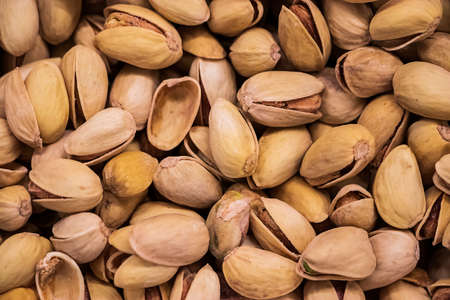 Background of fried pistachios. Nuts for a vegetarian diet.の写真素材