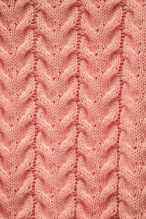 The texture of a knitted cozy sweater. Knitting, home accessories.