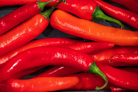 Ripe red hot chili peppers close-up. Vegetables for Mexican dishesの写真素材