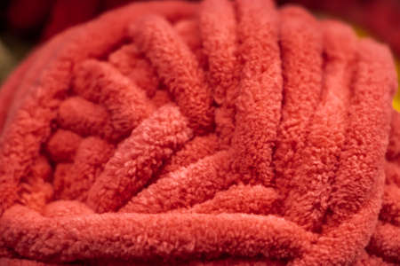 Texture of pink fluffy woolen threads for knitting closeup.の写真素材