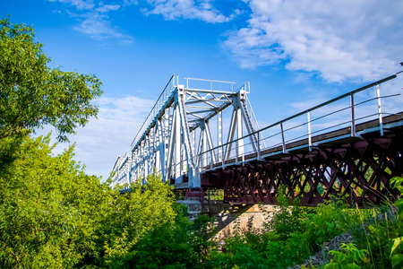 Beautiful railway bridge on a background of greeneryの写真素材