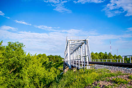 Beautiful railway bridge on a background of greenery