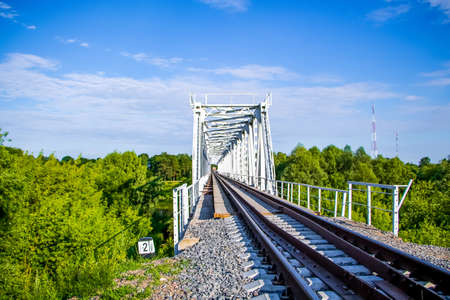 Beautiful railway bridge on a background of greenery